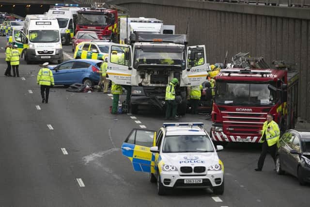 A lorry and several cars were involved in a crash on the M8. Picture: Mike McGurk