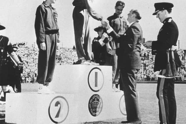 Joe McGhee collects his medal in Vancouver