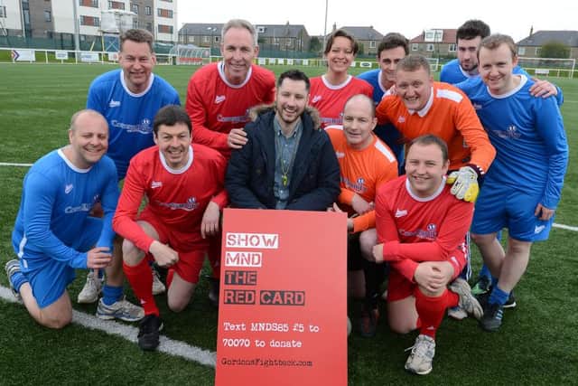 Gordon Aikman, centre, joined by Tory and Labour party members for a kick-about in Edinburgh. Picture: Neil Hanna