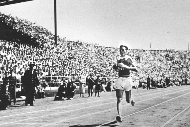 Joe McGhee, then aged 25, crosses the line to win gold at the 1954 Commonwealth Games. Picture: Contributed