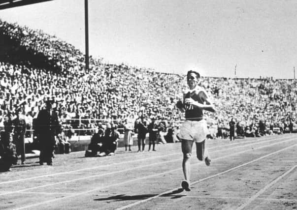 Joe McGhee, then aged 25, crosses the line to win gold at the 1954 Commonwealth Games. Picture: Contributed