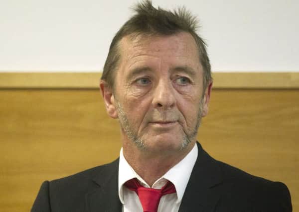 AC/DC drummer Phil Rudd stands in the dock in a Tauranga court. Picture: AP