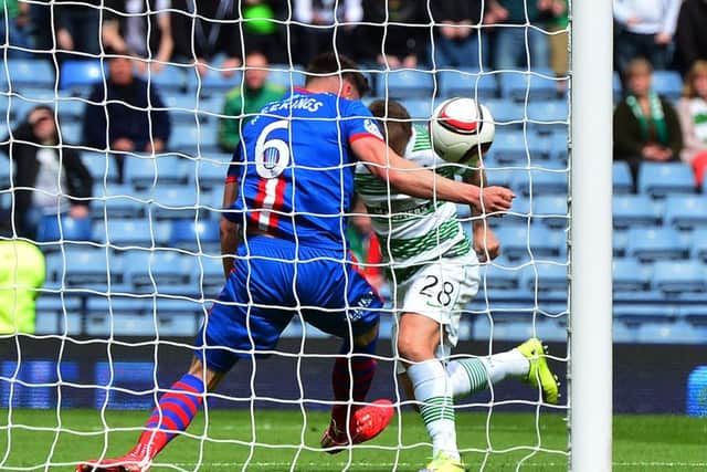 Josh Meekings handles the ball on the goal line from Leigh Griffiths. Picture: Getty