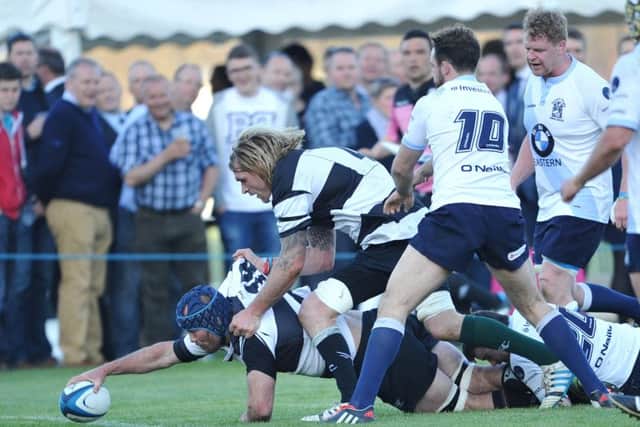 Barbarians' Chris Jones stretches out to score assisted by exScotland international Scott MacLeod. Picture: Ian Rutherford