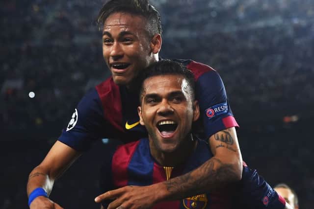 Neymar celebrates with Daniel Alves after scoring his second goal of the night. Picture: Getty