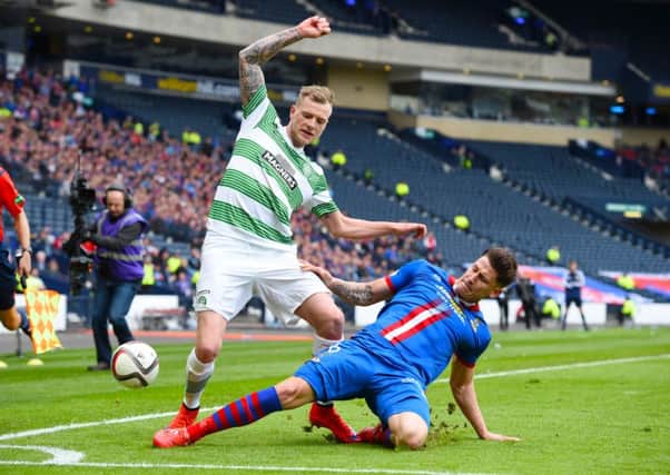 Celtic's John Guidetti (left) battles with Josh Meekings. Picture: SNS Group