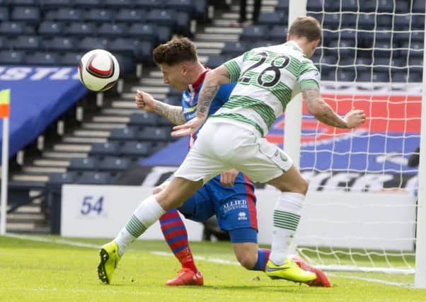 Celtic's Leigh Griffiths (right) heads the ball which is deflected of  Caley Thistle's Josh Meekings. Picture: PA