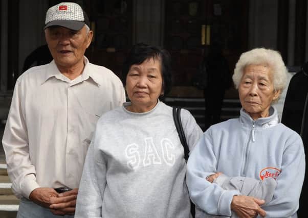 Loh Ah Choi, left, with Chang Koon Ying, centre, and Lim Ah Yin. Picture: PA