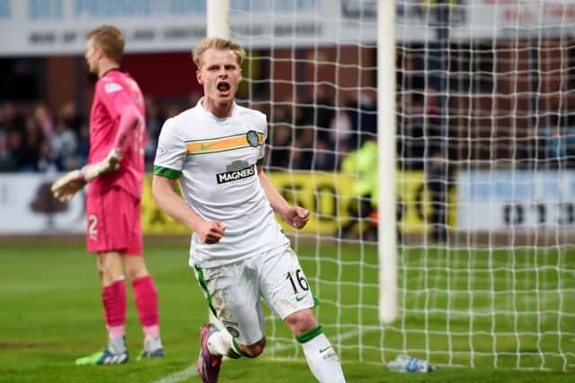 Gary Mackay-Steven celebrates after putting Celtic in front at Dens Park. Picture: SNS