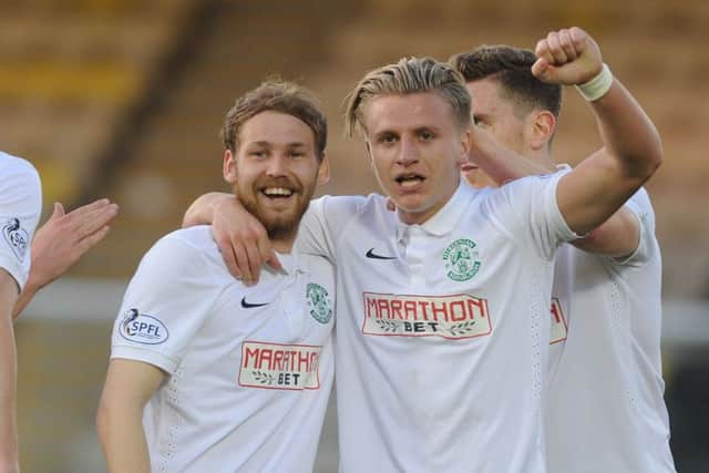 Jason Cummings, right, with Martin Boyle, celebrates putting Hibs back in front. Picture: Neil Hanna