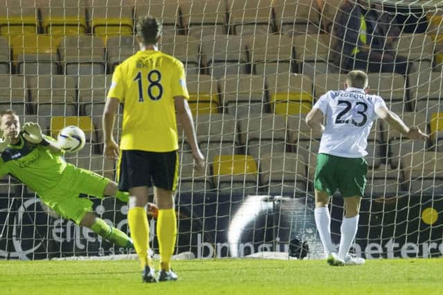 Livingston goalkeeper Darren Jamieson saves the penalty from Dylan McGeouch. Picture: SNS