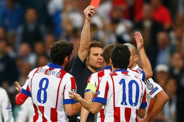 Arda Turan is sent off by referee Felix Brych. Picture: Getty