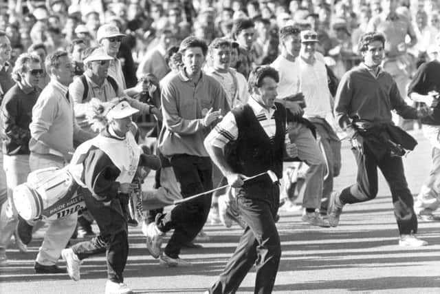 Fans chase Nick Faldo and caddy Fanny Sunneson up the 18th fairway at St Andrews. Picture: Alan Macdonald