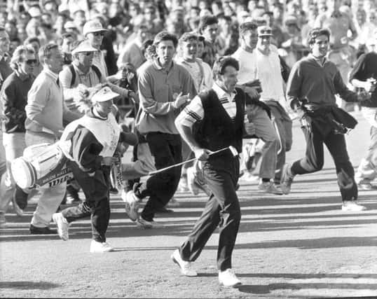 Fans chase Nick Faldo and caddy Fanny Sunneson up the 18th fairway at St Andrews. Picture: Alan Macdonald