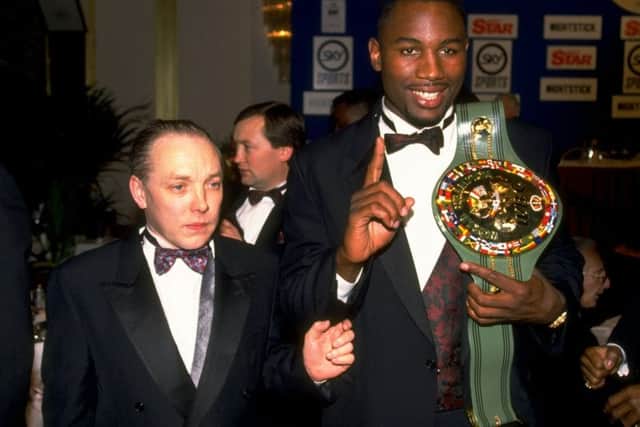 Maloney with world champion Lennox Lewis in 1992. Picture: Getty