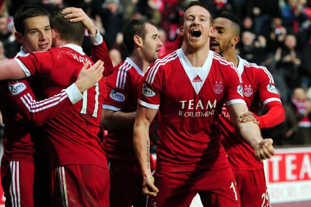 Adam Rooney, right, is among four players on the PFA Scotland shortlist. Picture: Ian Rutherford