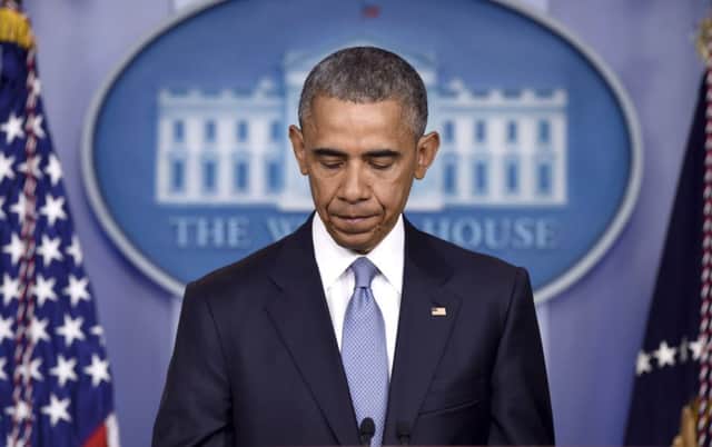 A grimfaced Barack Obama addresses the American people, accepting responsibility for the deaths. Picture: AP