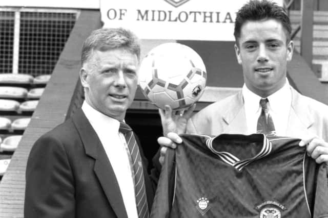 Kirkwood signing for Hearts in 1989 under Alex MacDonald. Picture: Albert Jordan