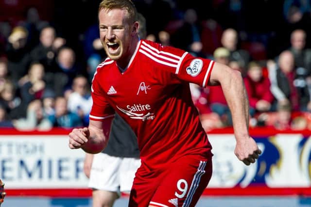 Aberdeen's Adam Rooney celebrates after putting his side 1-0 up against Dundee United. Picture: SNS Group