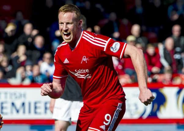 Aberdeen's Adam Rooney celebrates after putting his side 1-0 up against Dundee United. Picture: SNS Group