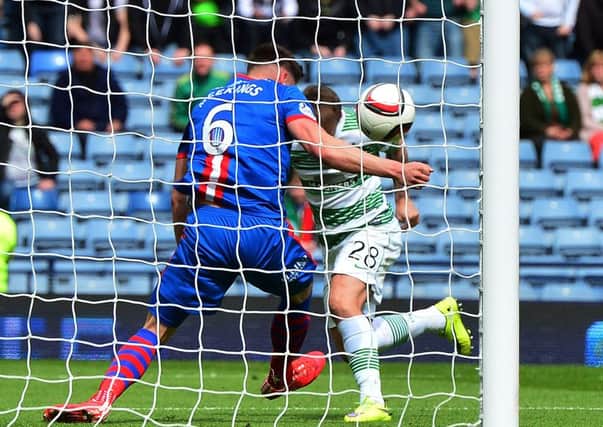 osh Meekings of Caledonian Thistle apparently handles the ball on the goal line from Leigh Griffiths of Celtic . Picture: Getty