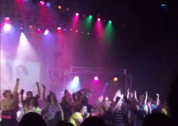 A still from video taken by Zach Rader shows students performing in the grand finale prior to the stage collapse. Picture: AP