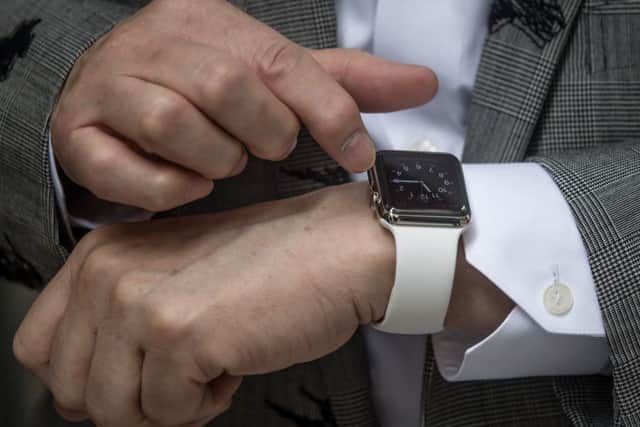 A man shows off his newly purchased Apple Watch. Picture: Getty