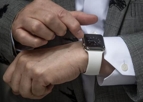 A man shows off his newly purchased Apple Watch. Picture: Getty