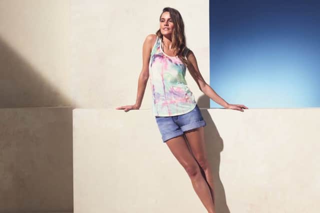 A model shows off an outfit from BHS, which is focusing on forming two food partnerships