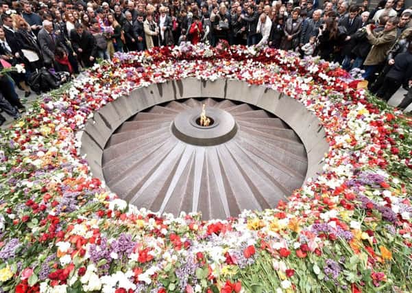 Dignitaries and local people lay flowers at the Tsitsernakaberd Memorial in Yerevan yesterday. Picture: Getty
