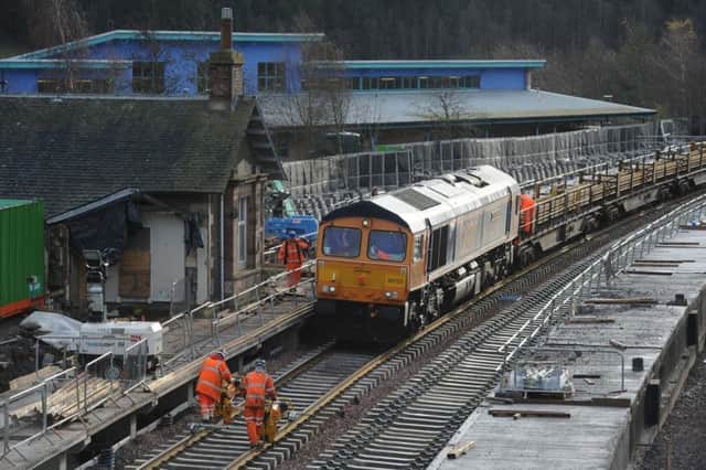 Rail workers lay track and points at Stow Station on the new Borders Railway. Picture: Stuart Cobley