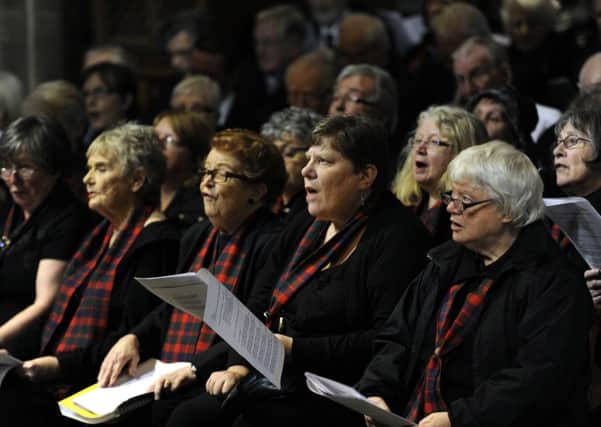 A memorial service is held last year in Glasgow Cathedral. Plans to charge visitors to enter the church are being opposed. Picture: John Devlin