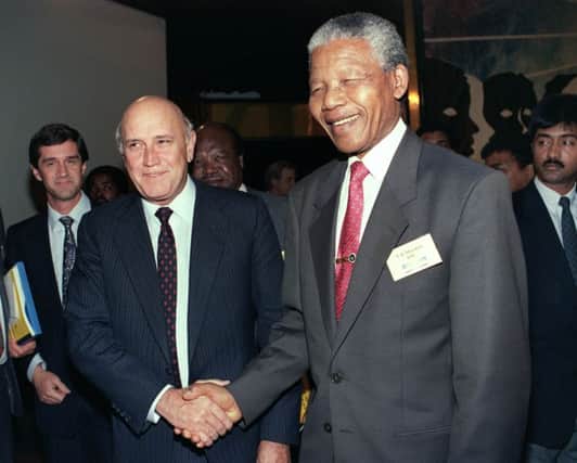 Nelson Mandela shakes hands with South Africas president Frederik W de Klerk, who he succeeded, in 1992. Picture: Getty