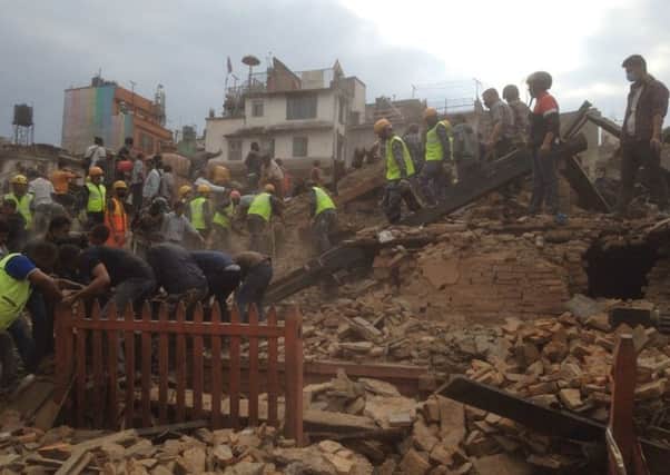 Rescuers clear the debris at Durbar Sqaure. Picture: AP