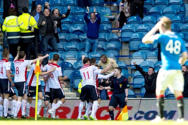 Falkirk's John Baird (right) celebrates opening the score at Ibrox. Picture: SNS