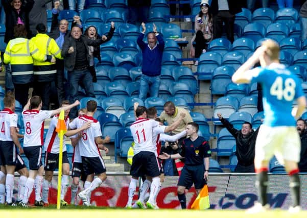 Falkirk's John Baird (right) celebrates opening the score at Ibrox. Picture: SNS