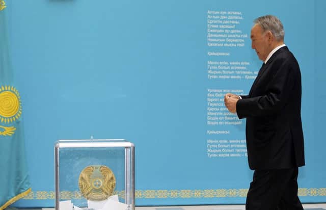 Nazarbayev casts his vote yesterday, after pushing a message of national stability and ethnic harmony. Picture: AP