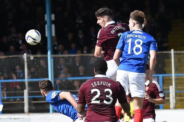Callum Paterson, playing as a target man, rises highest to head home Hearts equaliser. Picture: David Lamb