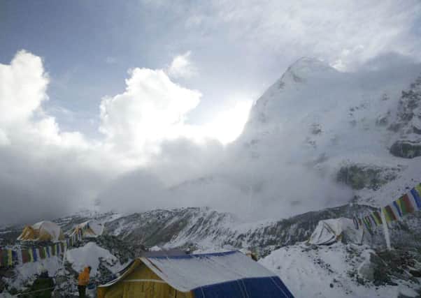 A small avalanche on Pumori mountain as seen from Everest Base Camp, Nepal on Sunday, April 26, 2015. Picture: AP