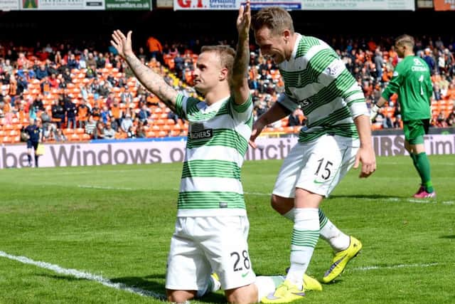 Celtic striker Leigh Griffiths (left) celebrates completing his hat-trick with his penalty. Picture: SNS