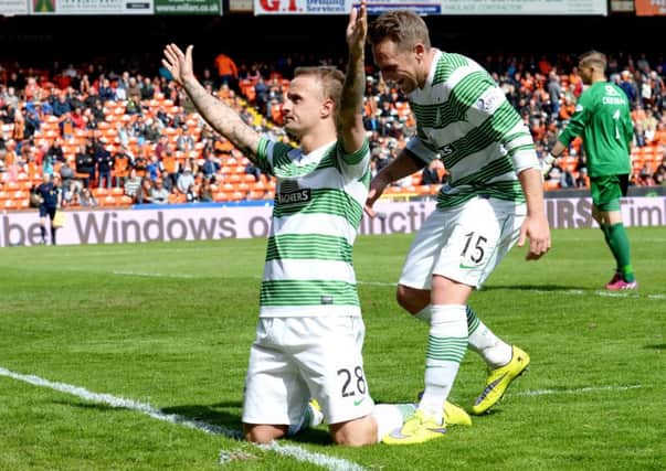 Celtic striker Leigh Griffiths (left) celebrates completing his hat-trick with his penalty. Picture: SNS