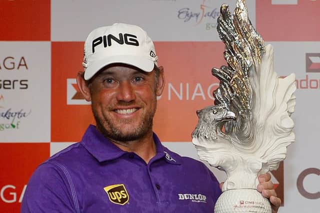 Lee Westwood lifts the Indonesian Masters trophy for the third time. Picture: AFP/Getty