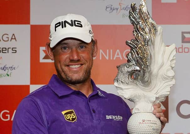 Lee Westwood lifts the Indonesian Masters trophy for the third time. Picture: AFP/Getty