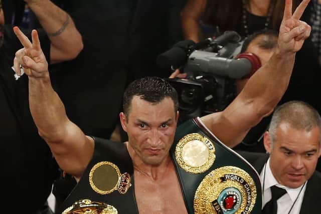 Klitschko with the heavyweight belts round his neck at the end of the night. Picture: AP