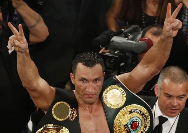 Klitschko with the heavyweight belts round his neck at the end of the night. Picture: AP