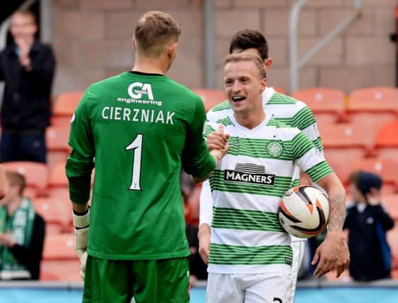 Leigh Griffiths shakes hands with Dundee United goalkeeper Radoslaw Cierzniak. Picture: SNS