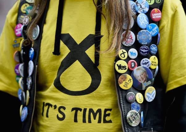 A voter shows support for the SNP at the Hope Over Fear Rally in Glasgow on Saturday. Picture: Getty