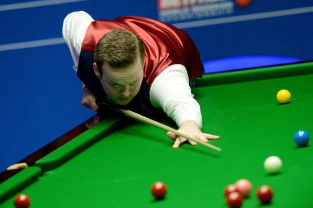 Shaun Murphy shows his concentration during his second-round clash with Joe Perry. Picture: PA