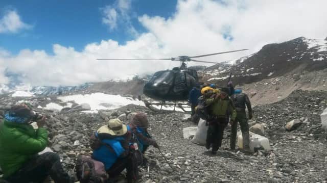 A rescue chopper lands carrying people from higher camps to Everest Base Camp, Nepal. Picture: AP