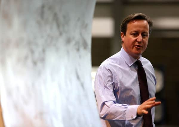 David Cameron inspects an industrial size extractor fan during a visit to Flakt Woods assembly plant in Colcheste last week. Picture: PA